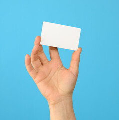 female hand holding a white black business card