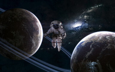 Wall Mural - astronaut in outer space. planets on background of galaxy. science fiction. elements of this image f