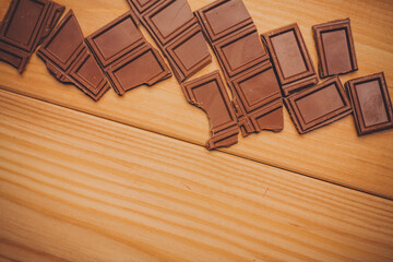 broken brown chocolate bar and background image texture top view