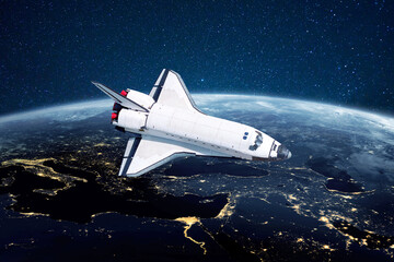 Poster - Space shuttle rocket flies over the blue planet earth with city lights on the background of stars. Spaceship launched into space start a mission and explore new planets
