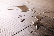 Waterproof Flooring - Spilled Water Drops On Wooden Laminate Floor
