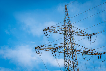 power pole in front of blue sky