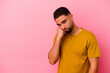 © Asier - Young mixed race man isolated on pink background