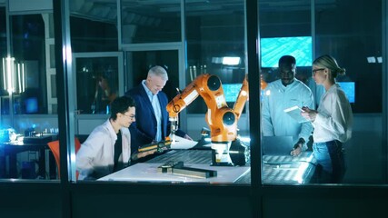 Wall Mural - researchers are working together on a robotics project. professional engineers working with innovati