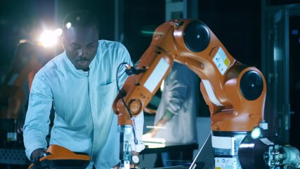 Wall Mural - robotic mechanism is being operated by an african specialist