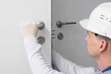 plumber, checks the correct operation of the locking devices of the door lock