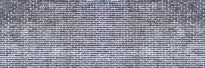  Old grey brick wall background texture close up.