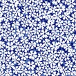 Ditsy floral pattern on blue background. Seamless vector pattern.