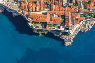 Canvas Print - Aerial overhead view of Church of St. Marija in Dubrovnik city wall by Adriatic sea in Croatia summer