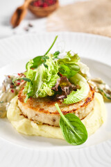 Poster - Mashed potatoes, mushrooms and rabbit cutlet. Restaurant food plate on white table. Delicious, healthy, organic dinner concept.