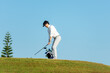 © freebird7977 - Golfer sport course golf ball fairway.  People lifestyle man playing game golf tee off on the green grass. Asian man player game shot in summer