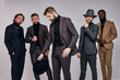 © Roman - Portrait of guys on men's fashion show, in party clothes in tux, interracial group of male models posing