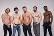 © Roman - Interracial group of young shirtless men posing seriously at camera, sexy guys in jeans having muscular body, fit and strong. people, models, fashion, masculinity concept
