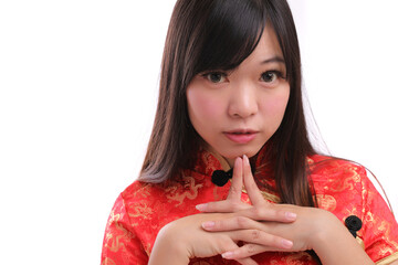 beauty woman wear red cheongsam looking and smile in chinese new year