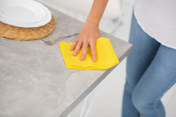 Close up of a housewife doing cleaning in the kitchen