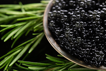 Wall Mural - Black caviar with green fresh rosemary