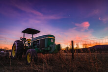 A Green Tractor Under Pretty Winter Skies On A Farm Just Outside Shenandoah National Park.