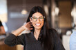 © Nikola Spasenoski - Successful happy business woman in a cafe enterier, smiling and looking at camera
