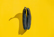 © Mikhaylovskiy  - old shriveled blackened bananas on yellow background. abstract image of the labia majora