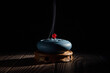 incense burner censer with smoke on black background.