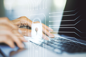 Aufkleber - Double exposure of creative lock hologram with chip and hands typing on laptop on background. Information security concept