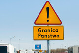 Fototapeta Psy - Znak ostrzegawczy o końcu granicy Polski
