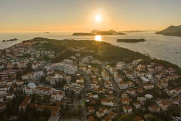 Canvas Print - Aerial drone shot of sunset over Adriatic islands view from Dubrovnik Babin Kuk hill in Croatia summer