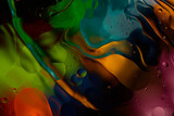 Fototapeta  - bright colorful oily drops in water with colorful background, close-up 