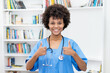 © Daniel Ernst - Pretty afro american female nurse ready for vaccinating patients