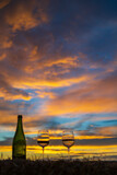 Fototapeta  - glass of wine with sunset in late summer