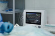 © Alberto Ortega/ADDICTIVE STOCK - Crop anonymous veterinarian in sterile gloves operating animal near EKG test monitor in hospital