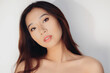 © Victor Torres/ADDICTIVE STOCK - Portrait of naked young Chinese woman looking at camera over white background