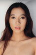 © Victor Torres/ADDICTIVE STOCK - Portrait of naked young Chinese woman looking at camera over white background