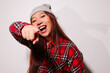 © Victor Torres/ADDICTIVE STOCK - Close-up portrait of cheerful Asian young woman pointing at camera with finger