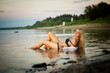 © Ekaterina - blonde girl in white shirt on the beach, selective focus