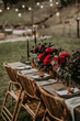 © Joy Zamora/ADDICTIVE STOCK - Wooden table served with plates and decorated with flowers in garden for wedding party