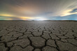 © Juan Lopez/ADDICTIVE STOCK - From above of drought cracked lifeless ground under colorful cloudy sky at sunset time