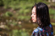 © Juan Alberto Ruiz/ADDICTIVE STOCK - Side view of tranquil Asian female standing in nature in Taiwan on sunny day in summer and looking away