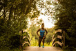 © Josu Torrealday/ADDICTIVE STOCK - Determined slim sportswoman doing lunges and stretching legs during workout in summer in Salburua park