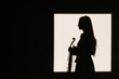 © Joseph Table/ADDICTIVE STOCK - Side view silhouette female violinist standing with musical instrument and thoughtfully looking away