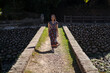© Juan Alberto Ruiz/ADDICTIVE STOCK - Female in maxi dress standing on Daping Red Bridge during vacation in Taiwan in summer