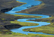 © PACO FARERO/ADDICTIVE STOCK - From above of picturesque landscape of bright blue river flowing among volcanic terrain in Iceland