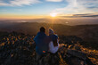 © Ruben Soto/ADDICTIVE STOCK - Back view of anonymous couple of tourists admiring majestic mountains under shiny sky in sunlight