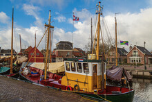 View Of The Harbor Of The Fishing Village On The Former Zuiderzee With Old Traditional Botter Fishing Boats.
