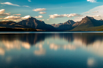 Wall Mural - dramatic, peaceful and  serene summer  sunset photo of Lake McDonald in Glacier National Park in. Montana.