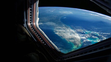 Poster - Spaceship flies near the amazing blue planet earth, view from the window. Travel and tourists in space, concept. Beautiful space view of the Earth with cloud formation. Hotel in space