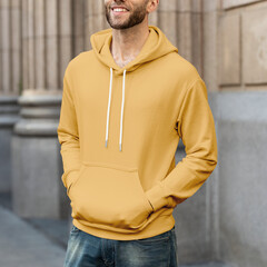 Wall Mural - Man in yellow hoodie streetwear men’s apparel fashion