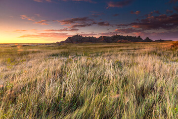 Wall Mural - Dramatic summer sunrise in the Badlands National Park in South Dakota.