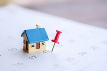 House Model And Red Pin Mark On Calendar, Due Date For Home Payment ,property Reminder Concept