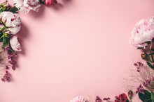 Assorted Pink Flower Border On Pink Background, Flat Lay
